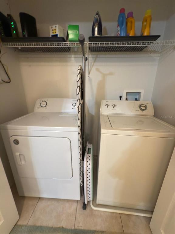 879 Assembly Court Reunion, FL 34747 - Photo 38 of 46 a utility room with dryer and washer