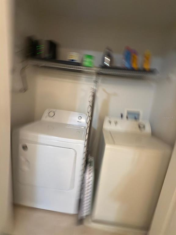 879 Assembly Court Reunion, FL 34747 - Photo 39 of 46 a utility room with dryer and washer