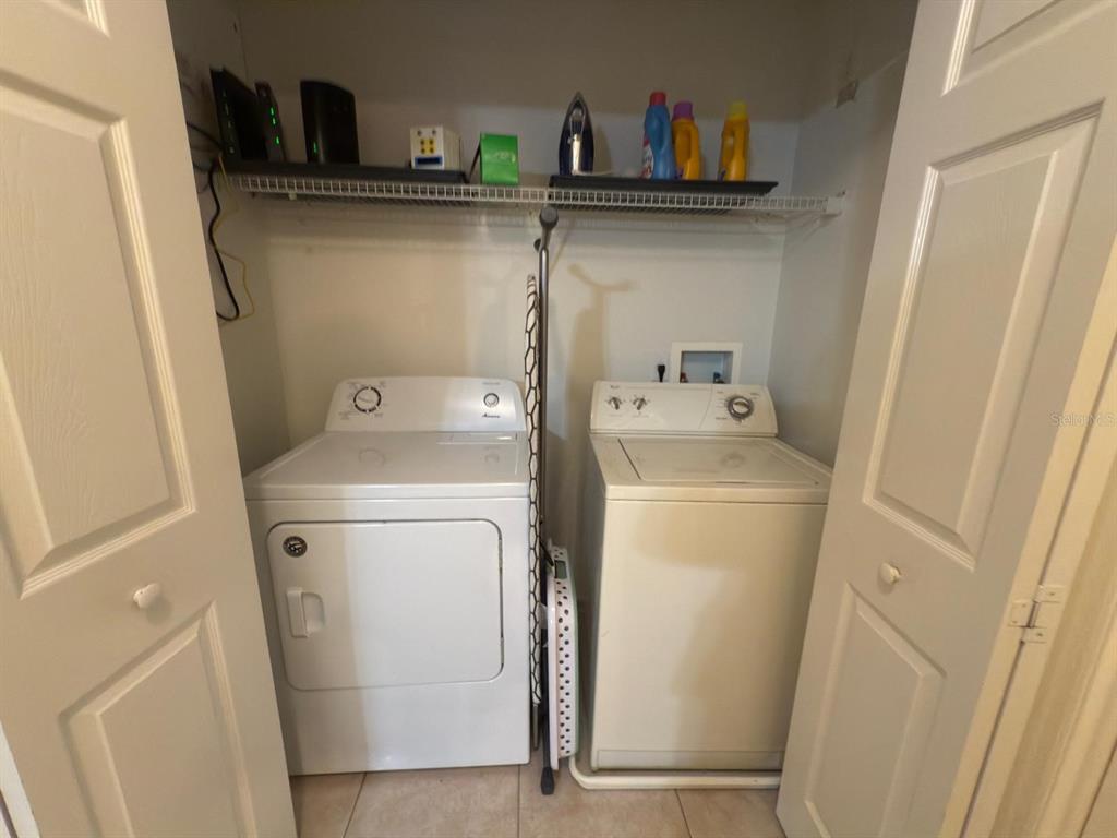 879 Assembly Court Reunion, FL 34747 - Photo 41 of 46 a utility room with dryer and washer
