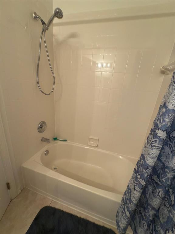 879 Assembly Court Reunion, FL 34747 - Photo 43 of 46 a bathroom with a bath tub and a shower