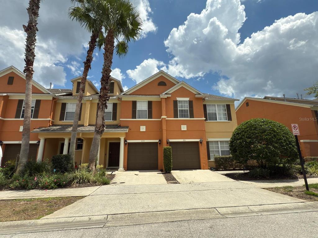 879 Assembly Court Reunion, FL 34747 - Photo 46 of 46 a front view of a house with a garden