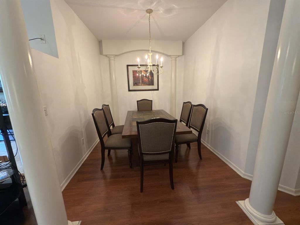 879 Assembly Court Reunion, FL 34747 - Photo 6 of 46 a dining room with furniture and window wooden floor