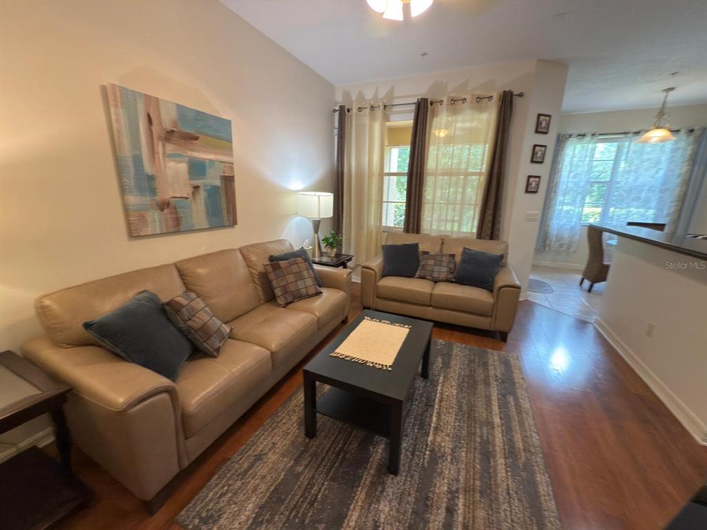 879 Assembly Court Reunion, FL 34747 - Photo 9 of 46 a living room with furniture and a large window
