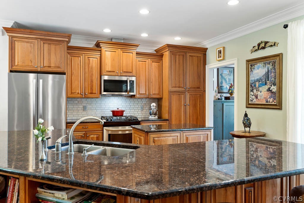 11205 Beaver Bridge Road Chesterfield, VA 23838 - Photo 6 of 42 a kitchen with kitchen island granite countertop a stove and a sink