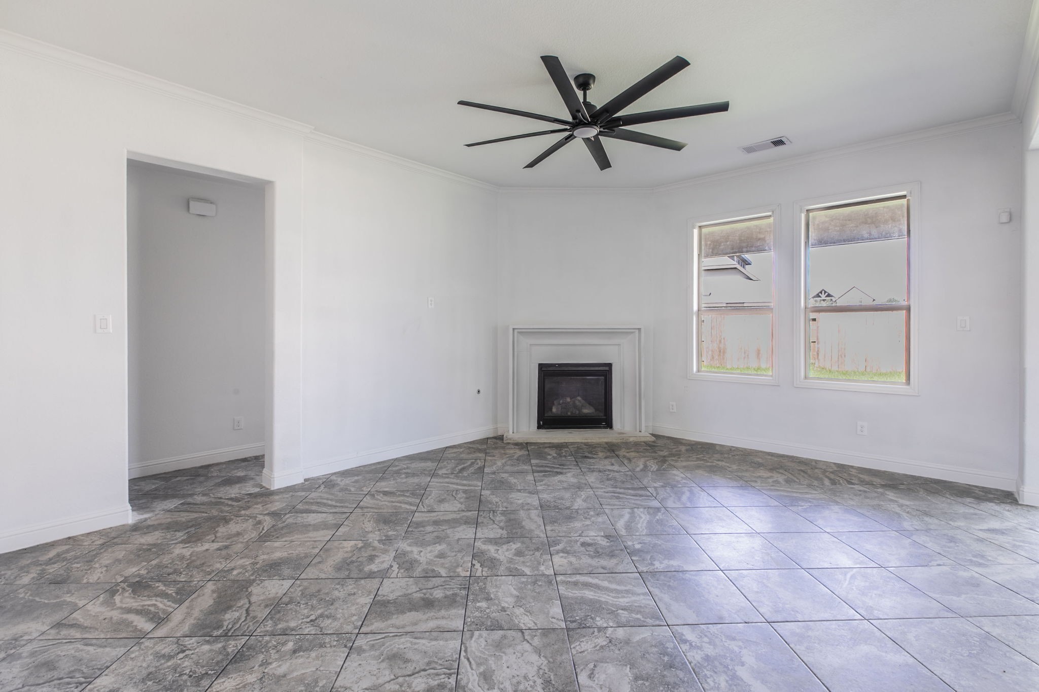4806 Timber Gate Court Rosharon, TX 77583 - Photo 14 of 36 an empty room with windows and fireplace