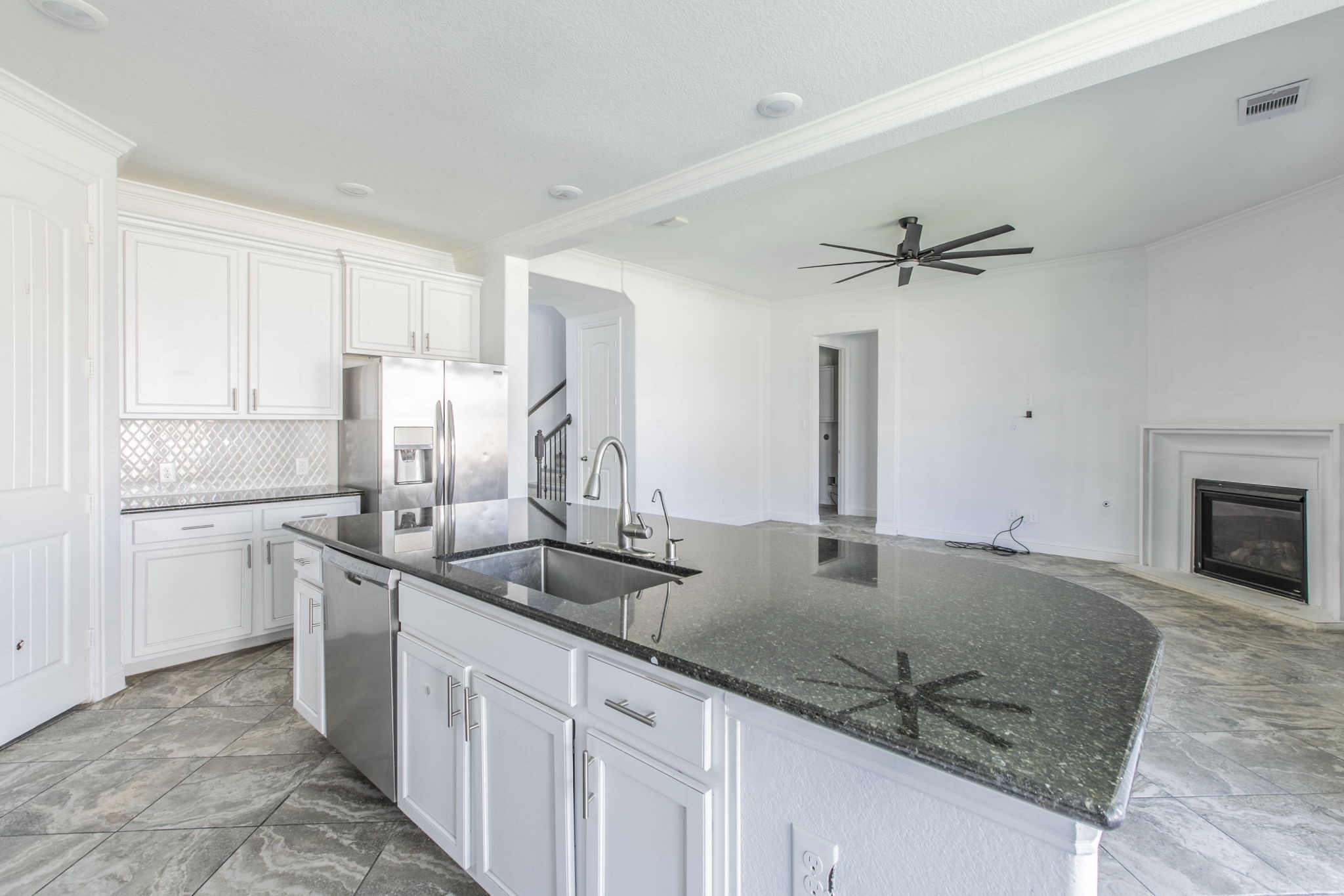 4806 Timber Gate Court Rosharon, TX 77583 - Photo 19 of 36 a kitchen with stainless steel appliances granite countertop a sink stove and refrigerator