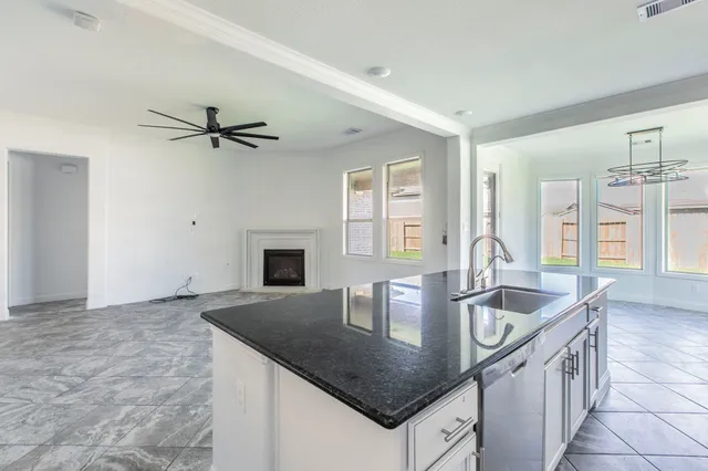 a kitchen with stainless steel appliances a refrigerator and a stove top oven