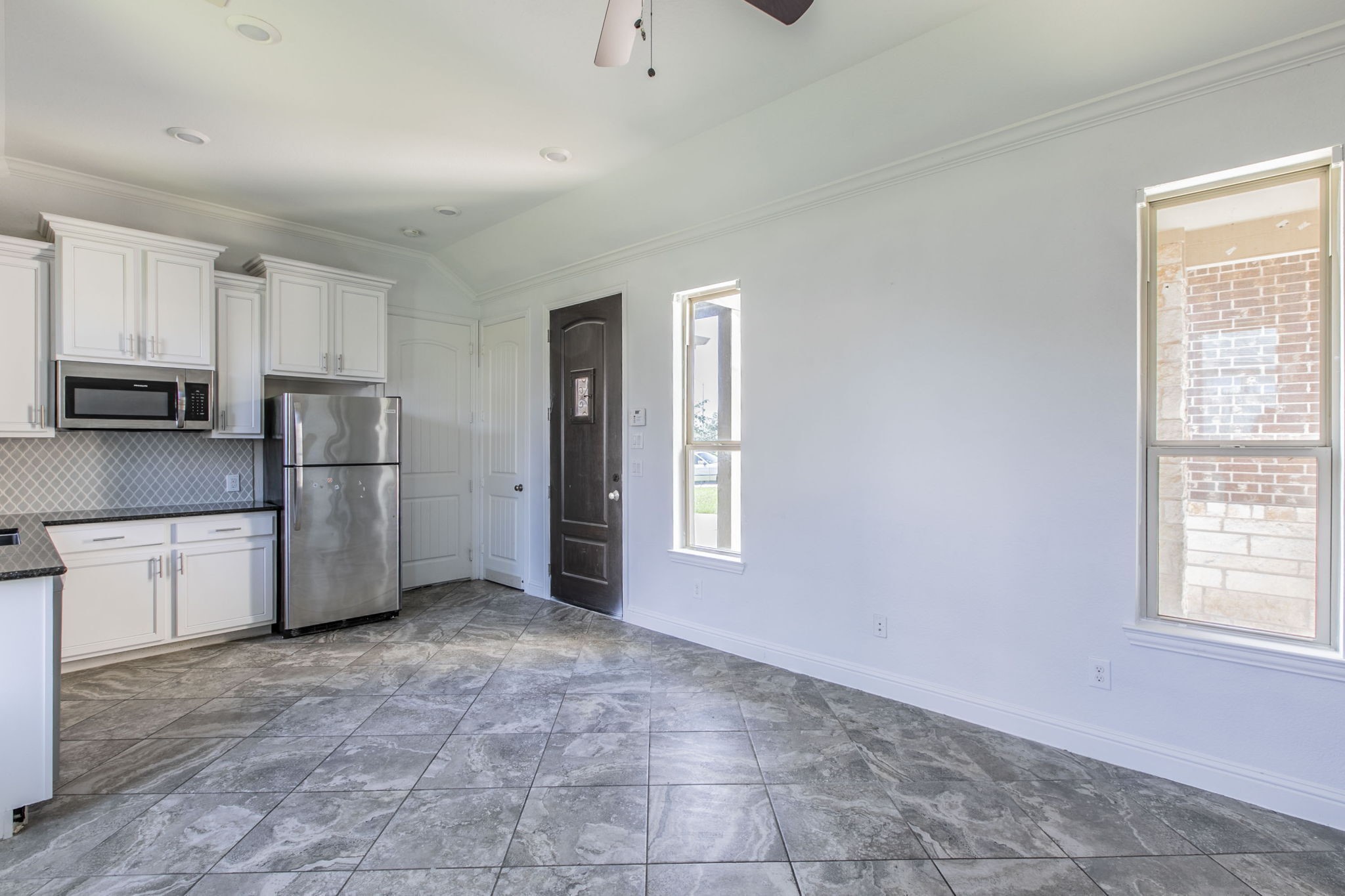 4806 Timber Gate Court Rosharon, TX 77583 - Photo 21 of 36 a kitchen with stainless steel appliances a refrigerator and a stove top oven