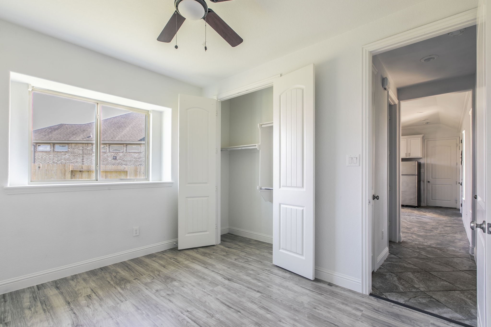4806 Timber Gate Court Rosharon, TX 77583 - Photo 23 of 36 wooden floor in an empty room with a window