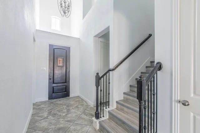 a kitchen with stainless steel appliances a refrigerator sink and cabinets