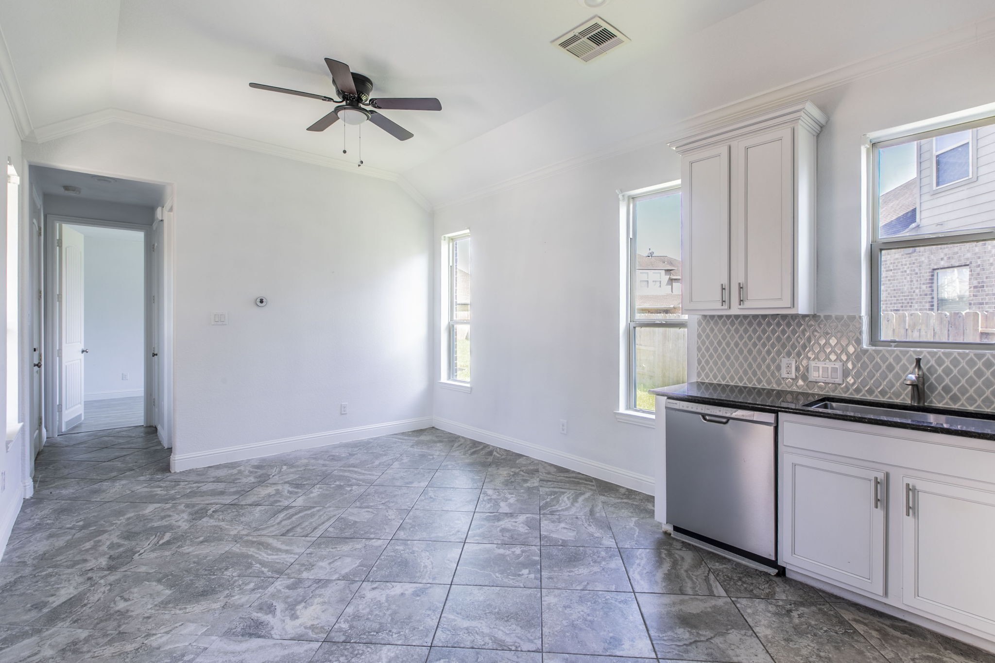 4806 Timber Gate Court Rosharon, TX 77583 - Photo 29 of 36 a kitchen with granite countertop a sink and cabinets