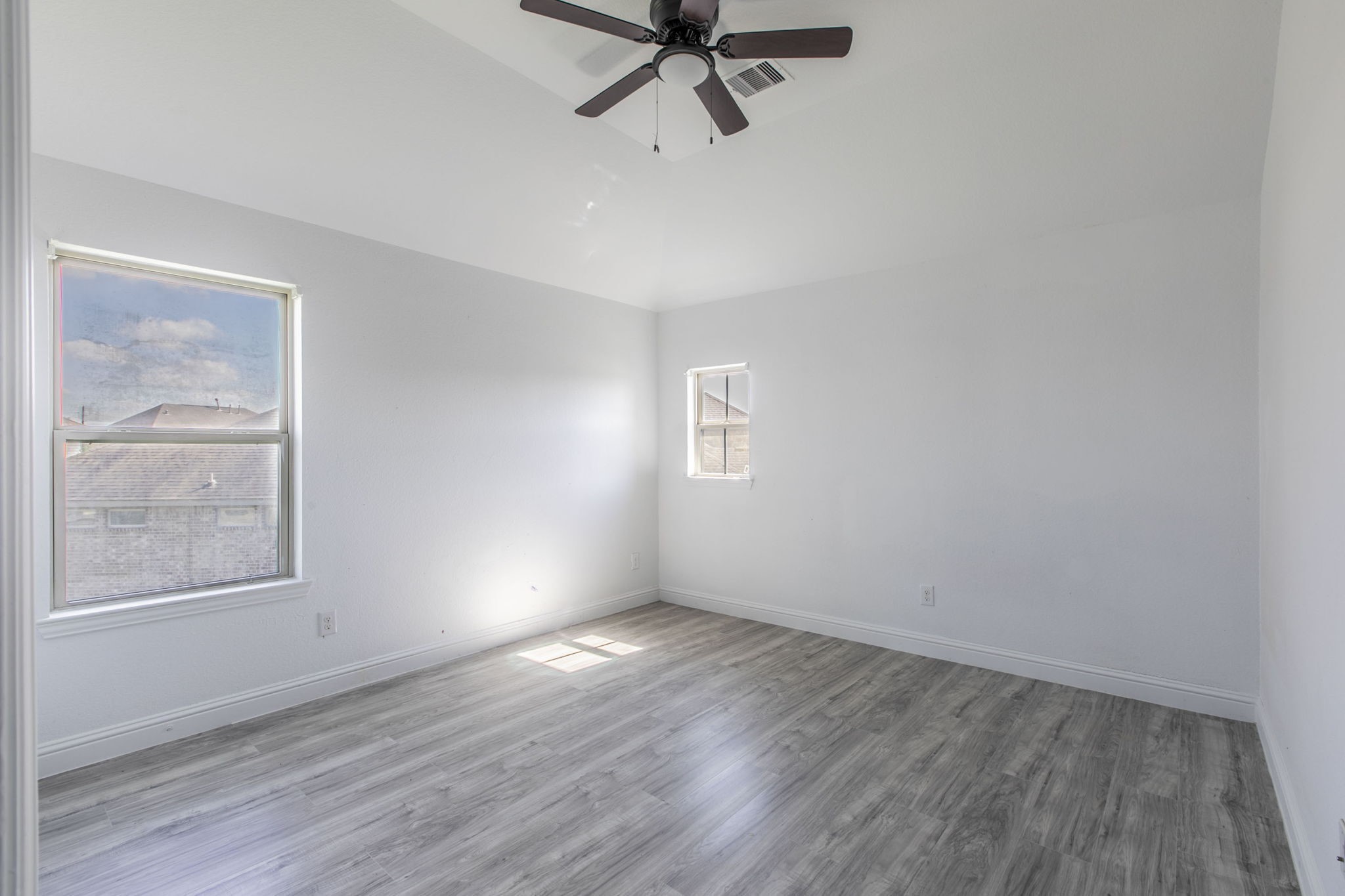 4806 Timber Gate Court Rosharon, TX 77583 - Photo 3 of 36 wooden floor in an empty room with a window