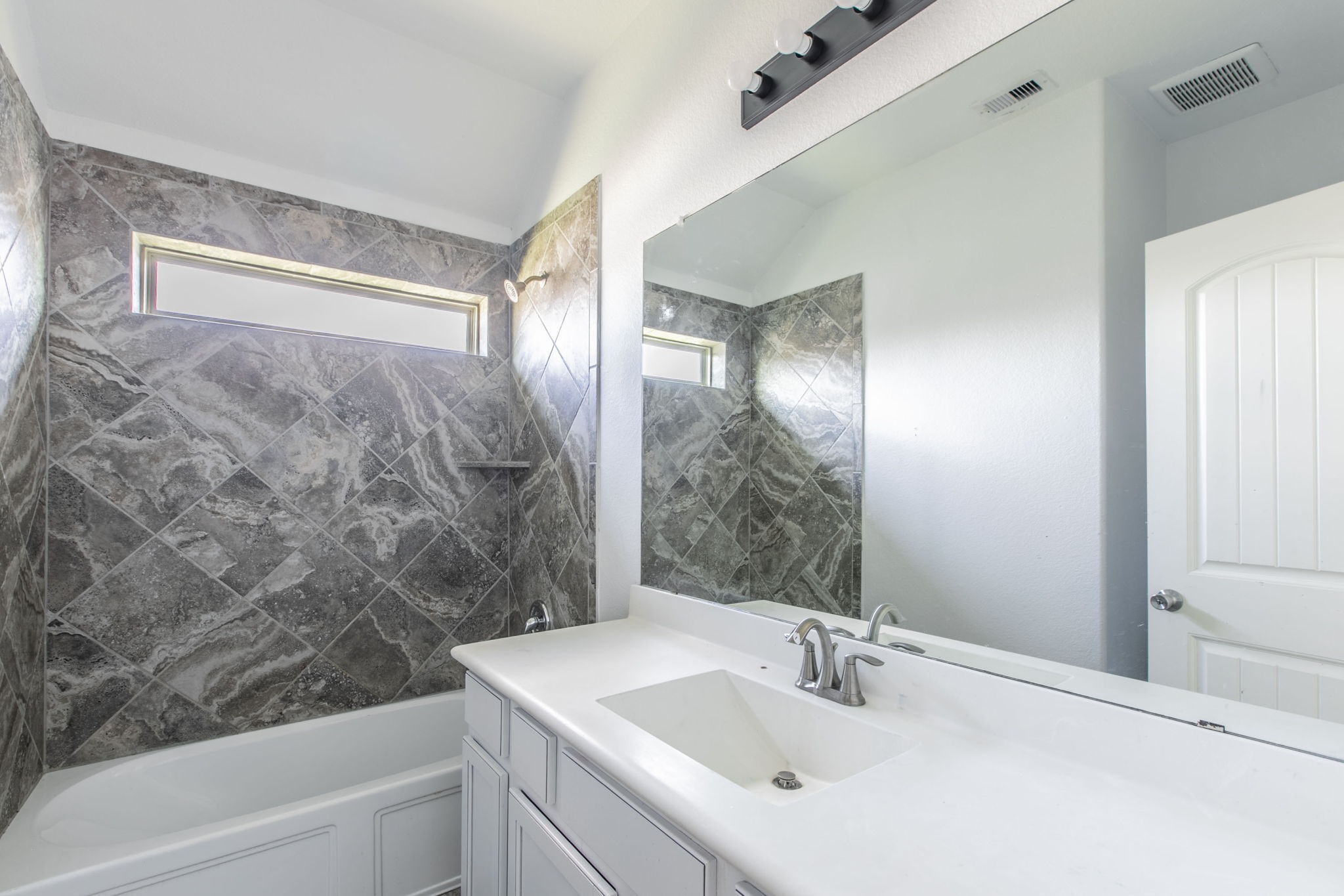 4806 Timber Gate Court Rosharon, TX 77583 - Photo 35 of 36 a bathroom with a sink and a mirror