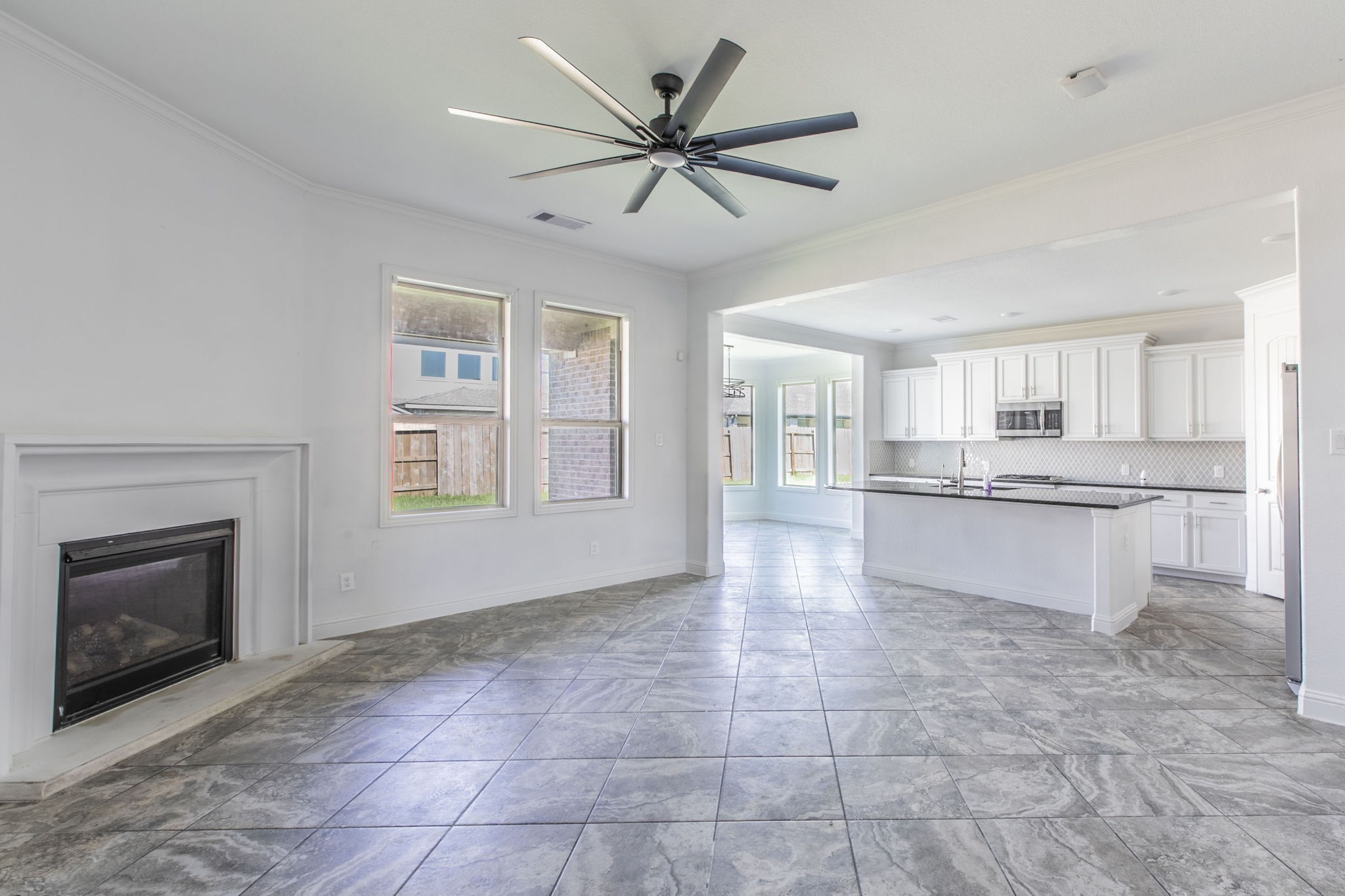 4806 Timber Gate Court Rosharon, TX 77583 - Photo 6 of 36 a view of an empty room with a fireplace and a window