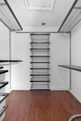 a bathroom with a double vanity sink a mirror and shower