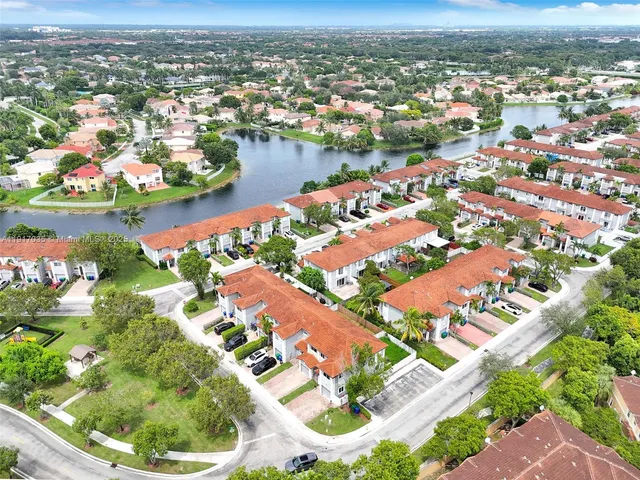 an aerial view of residential houses with outdoor space