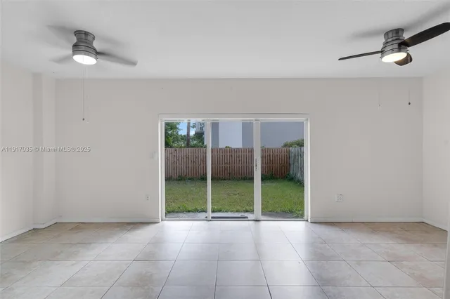 a kitchen with cabinets and window