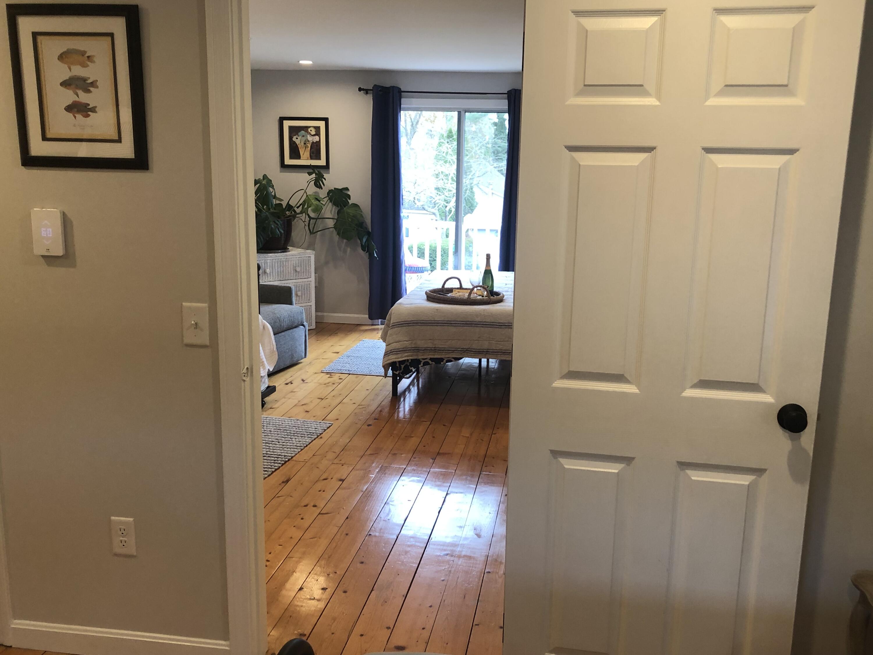 9 Bells Neck Road, Unit 10 West Harwich, MA 02671 - Photo 16 of 23 a view of a bedroom from a hallway