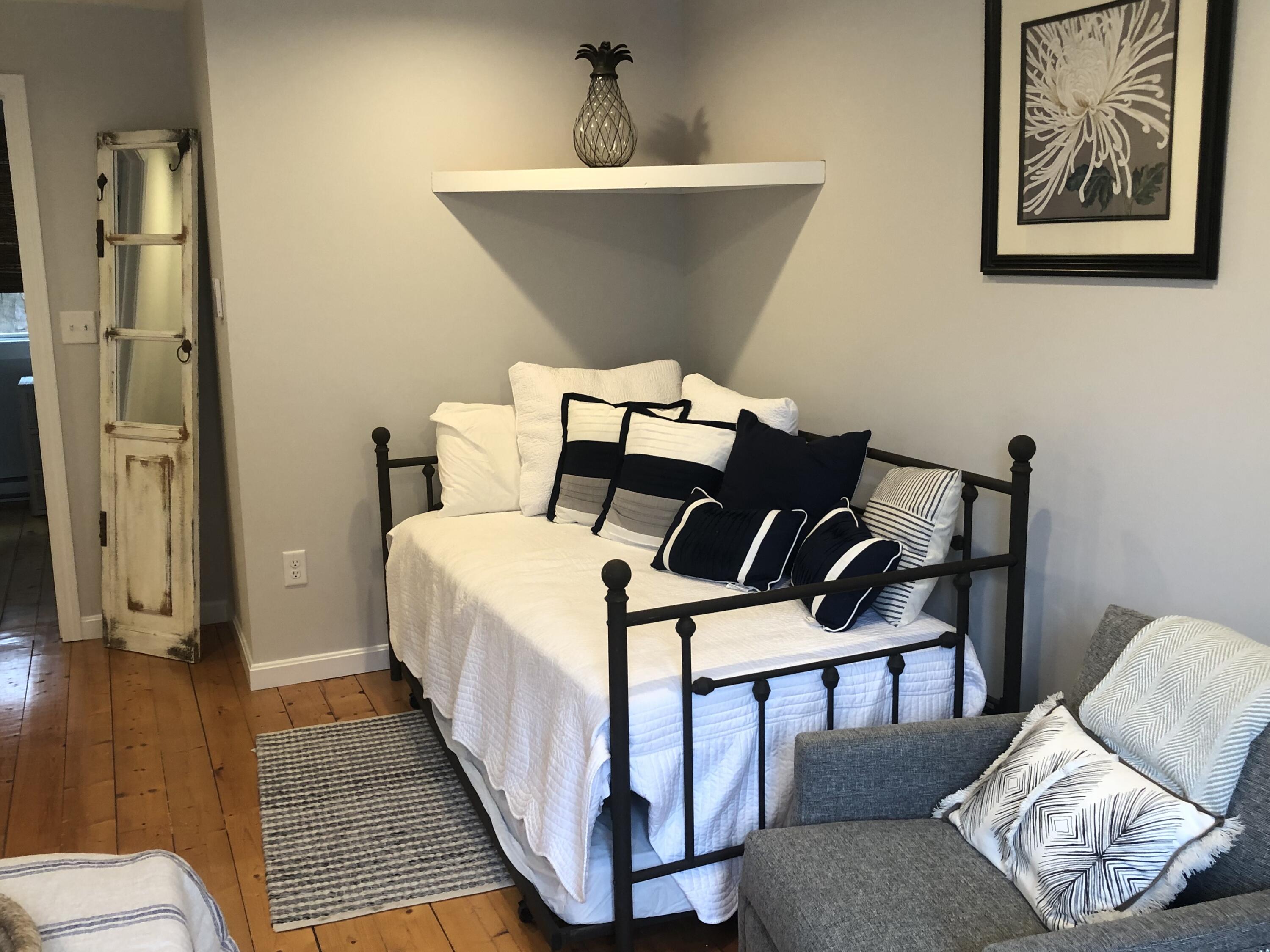 9 Bells Neck Road, Unit 10 West Harwich, MA 02671 - Photo 18 of 23 a bed room with a bed and chair