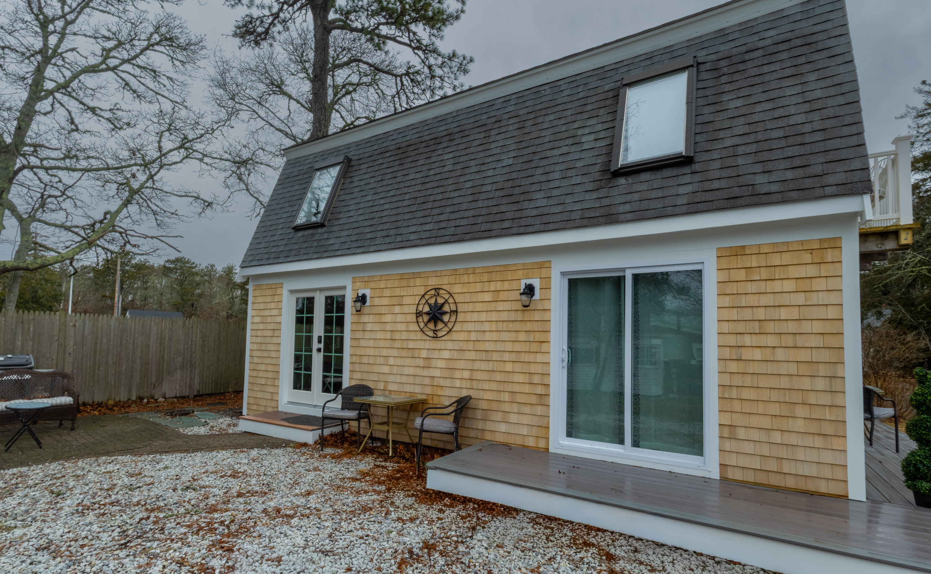 9 Bells Neck Road, Unit 10 West Harwich, MA 02671 - Photo 3 of 5 a front view of a house with a yard