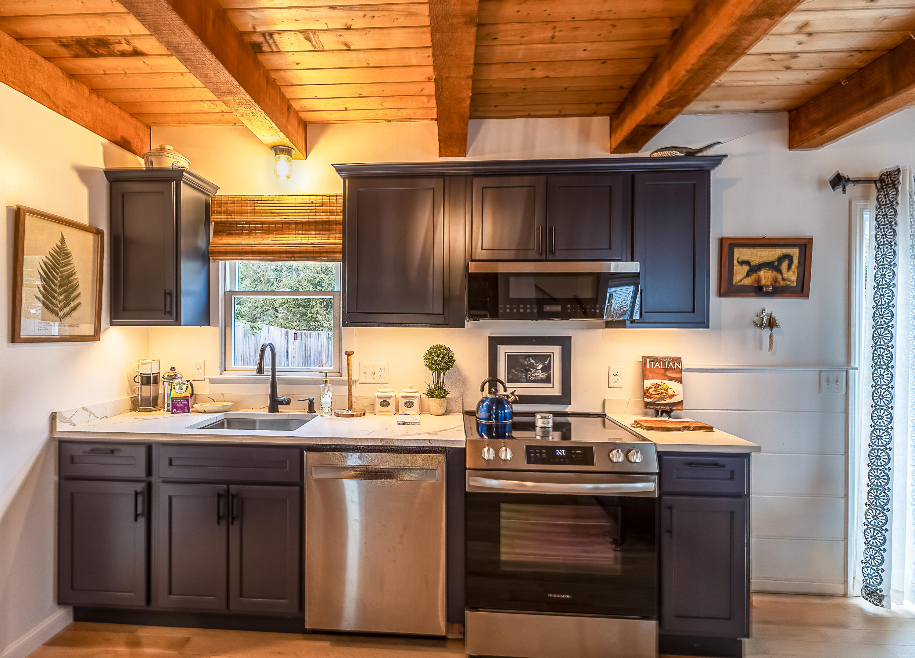 9 Bells Neck Road, Unit 10 West Harwich, MA 02671 - Photo 5 of 5 a kitchen with stainless steel appliances a sink a stove and a microwave