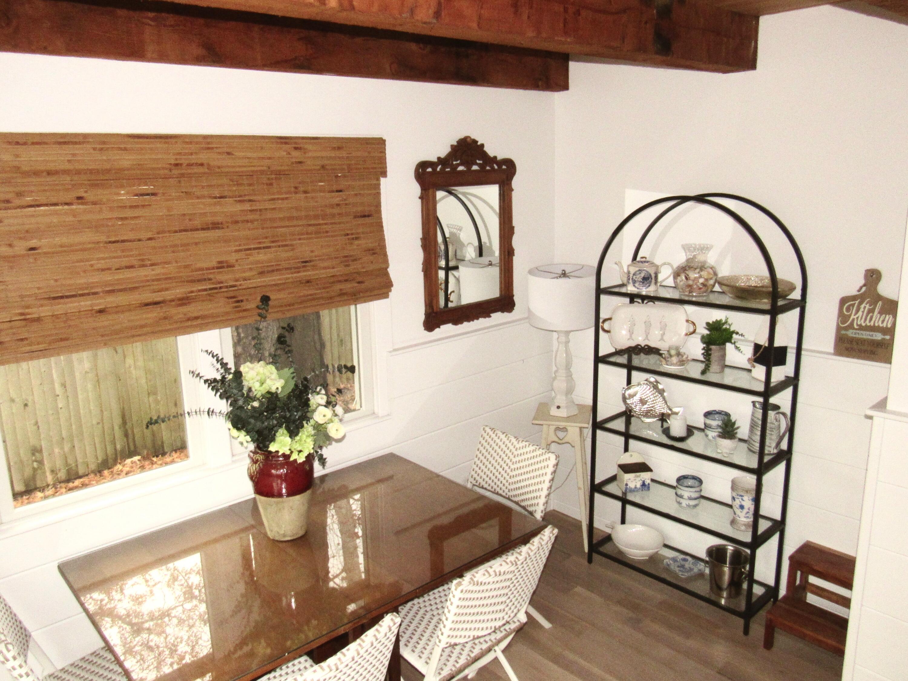 9 Bells Neck Road, Unit 10 West Harwich, MA 02671 - Photo 5 of 23 a dining room with furniture and wooden floor
