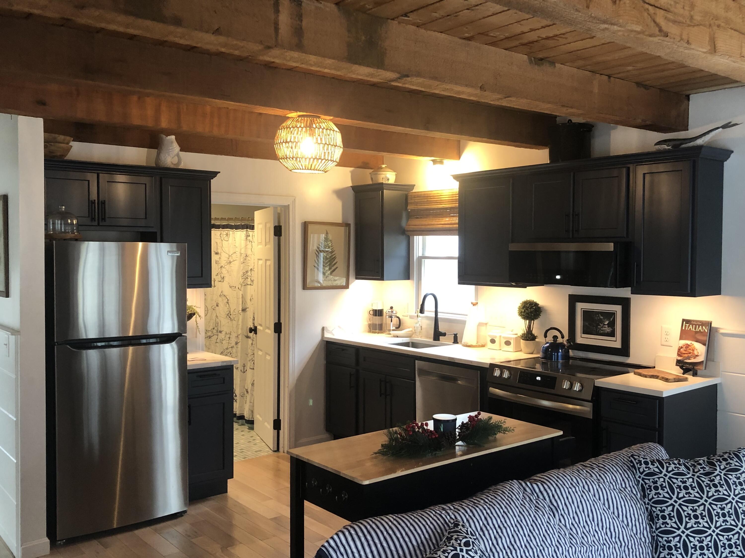 9 Bells Neck Road, Unit 10 West Harwich, MA 02671 - Photo 7 of 23 a kitchen with a refrigerator and a sink