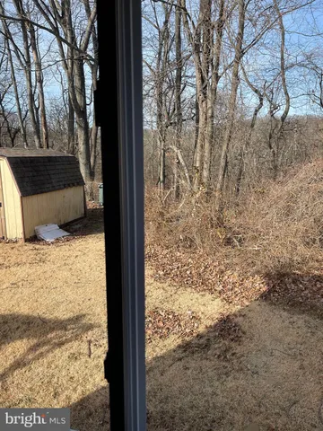 a view of balcony with wooden floor