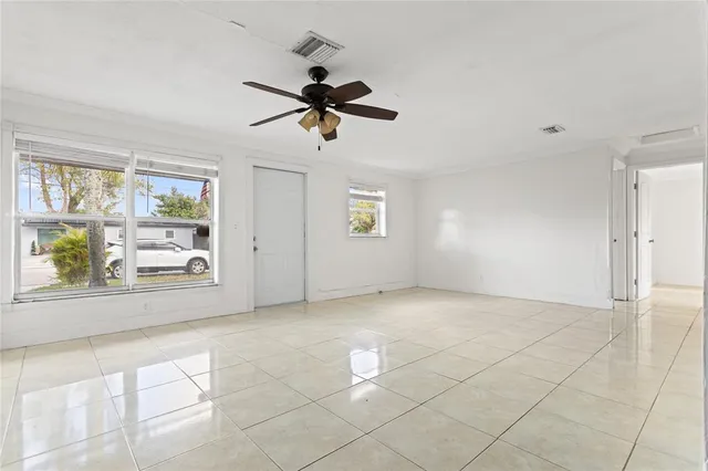 a view of an empty room with a window