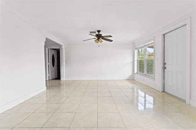 a view of an empty room with a window