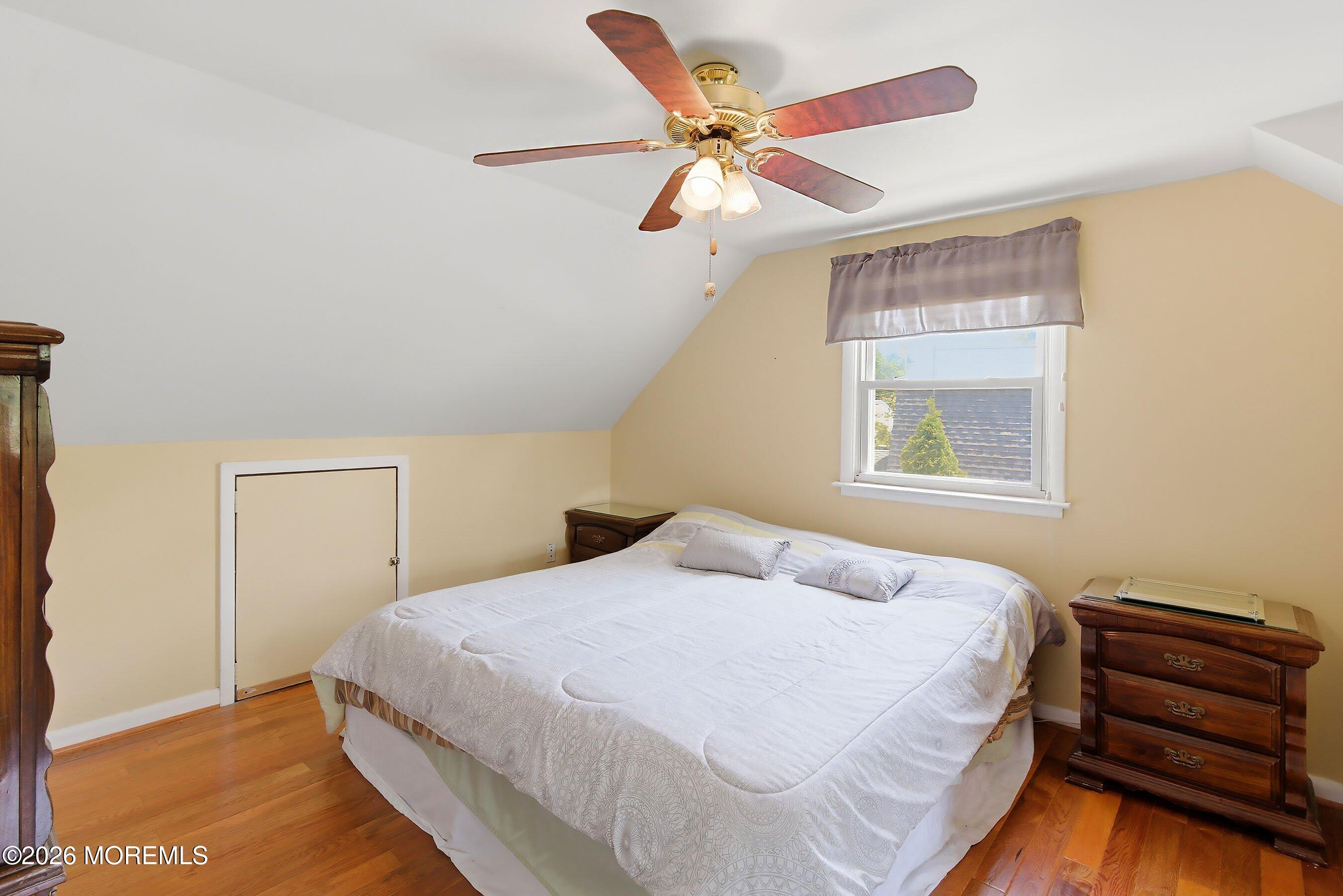 412 Moore Road Neptune Township, NJ 07753 - Photo 17 of 36 a bedroom with a bed and a window