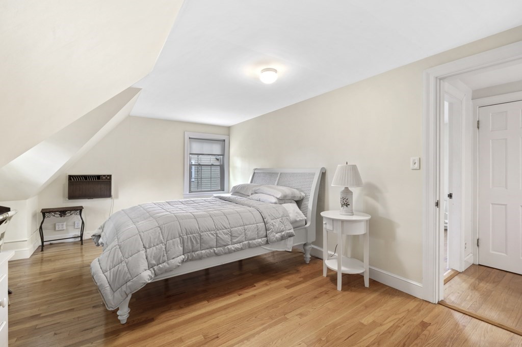 5 Auburndale Road Marblehead, MA 01945 - Photo 33 of 41 a bedroom with a bed and wooden floor