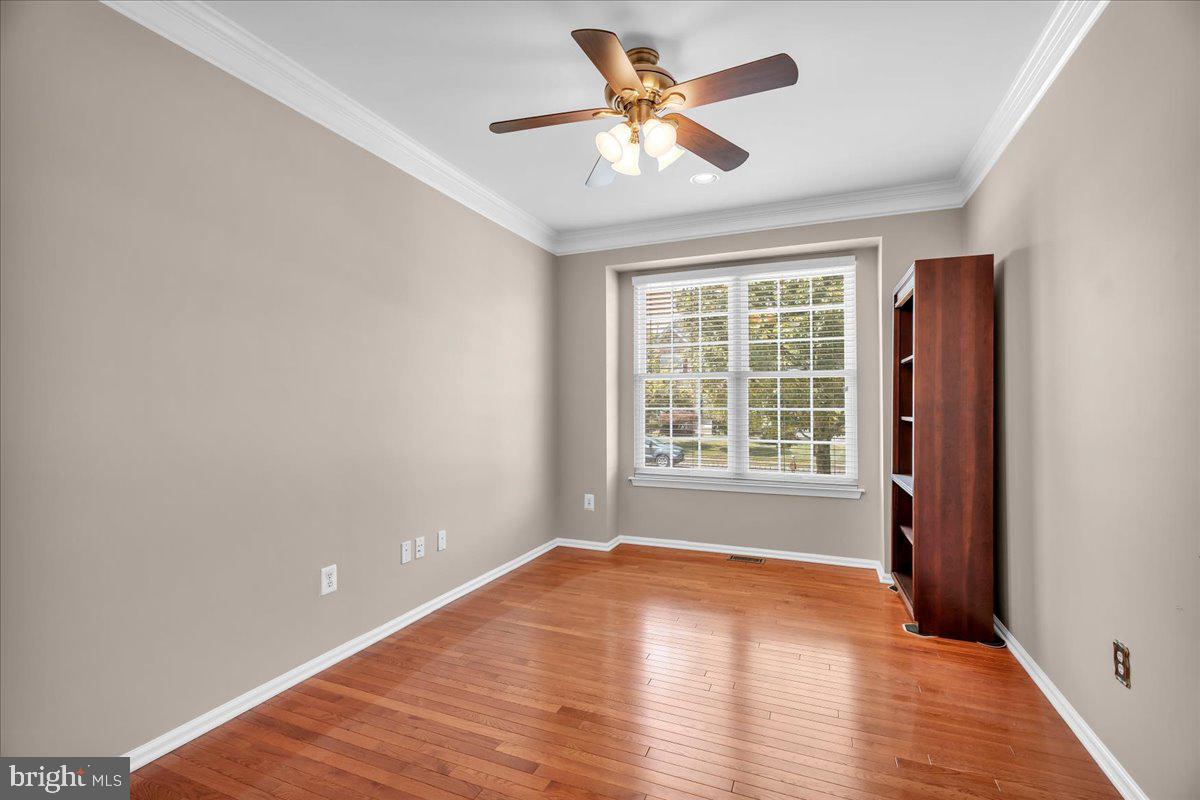 68 Hillside Lane Mount Laurel, NJ 08054 - Photo 5 of 36 a view of an empty room with a window and wooden floor