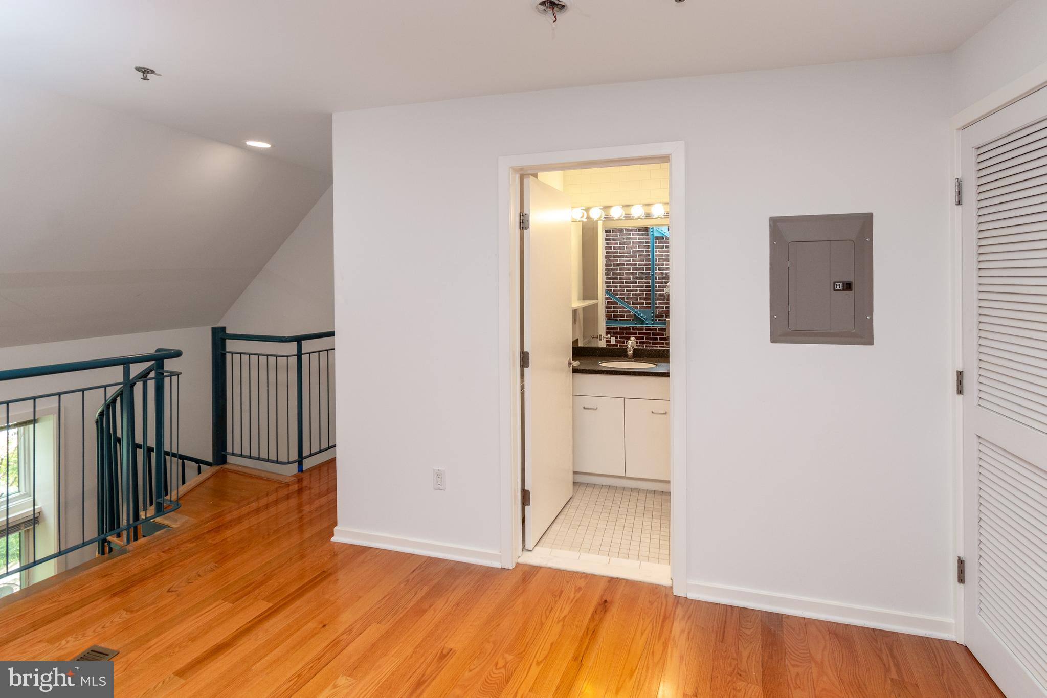36 Moore Street, Unit 8 Princeton, NJ 08542 - Photo 21 of 35 a view of a hallway with wooden floor and a kitchen space