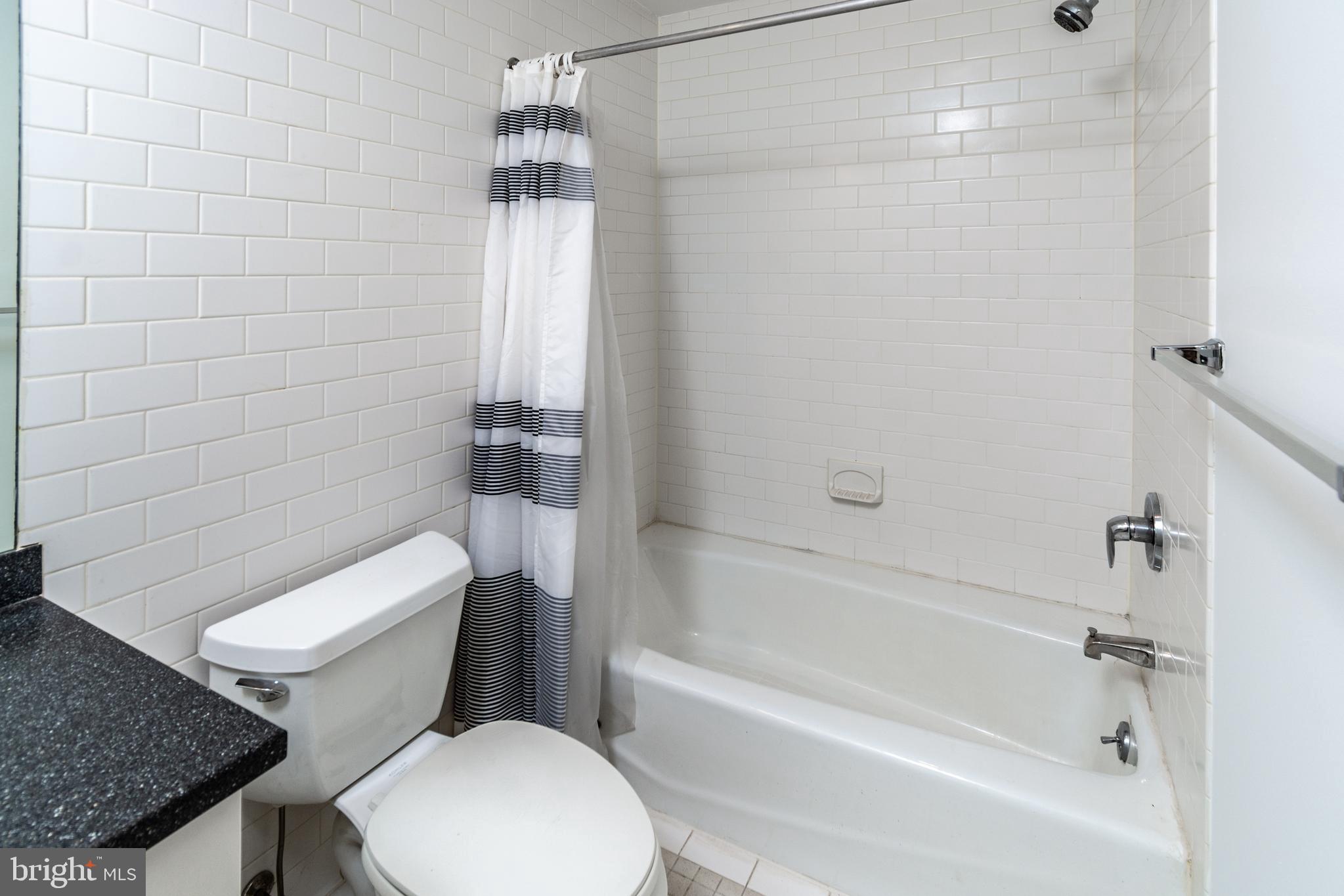 36 Moore Street, Unit 8 Princeton, NJ 08542 - Photo 25 of 35 a white toilet sitting next to a bath tub