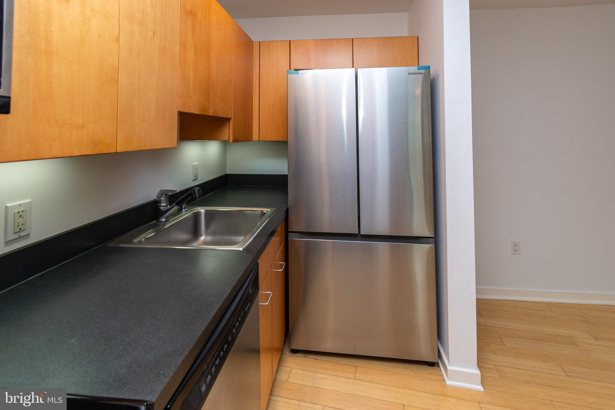 36 Moore Street, Unit 8 Princeton, NJ 08542 - Photo 8 of 35 a kitchen with metallic refrigerator and a sink
