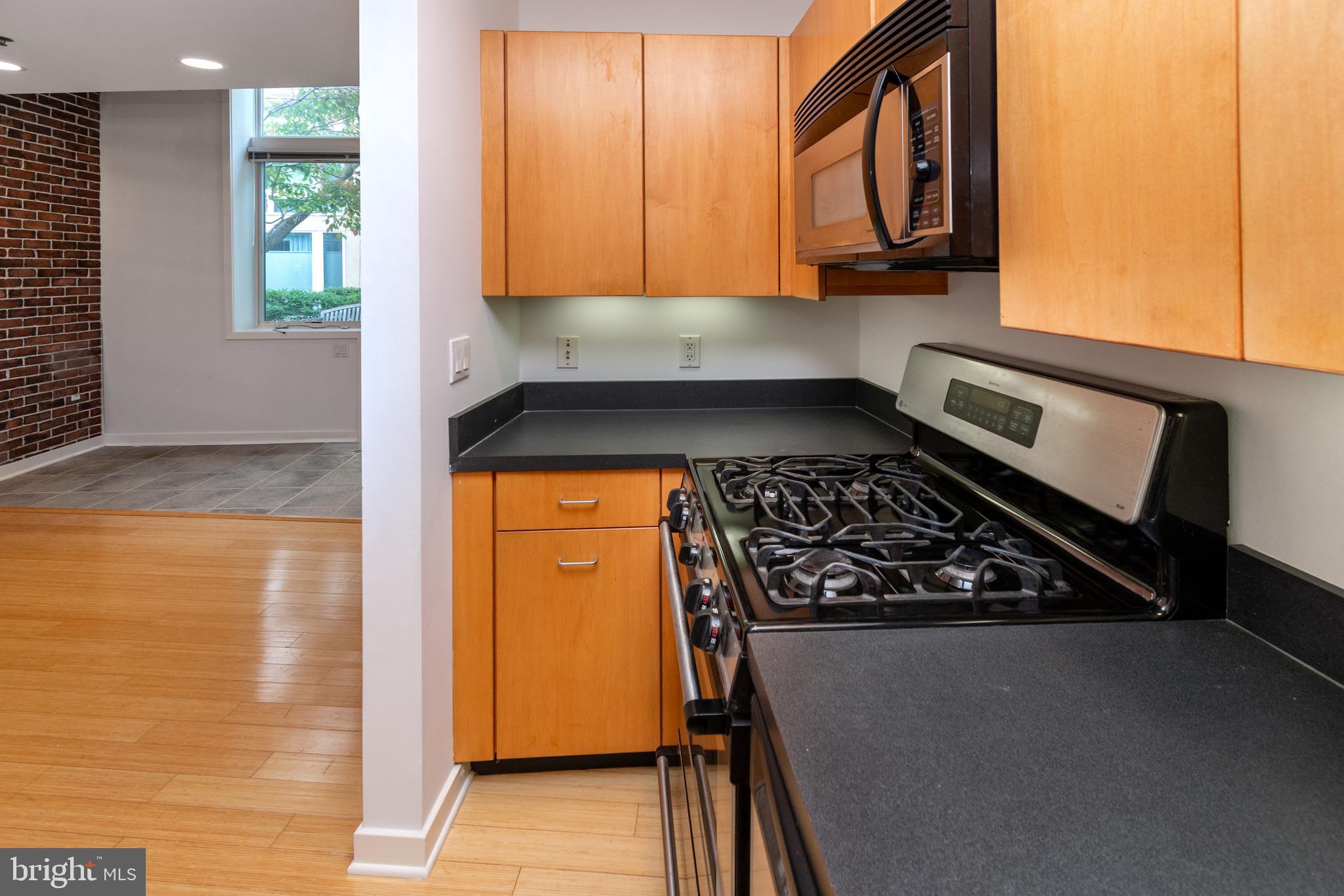 36 Moore Street, Unit 8 Princeton, NJ 08542 - Photo 9 of 35 a kitchen with a stove and a microwave