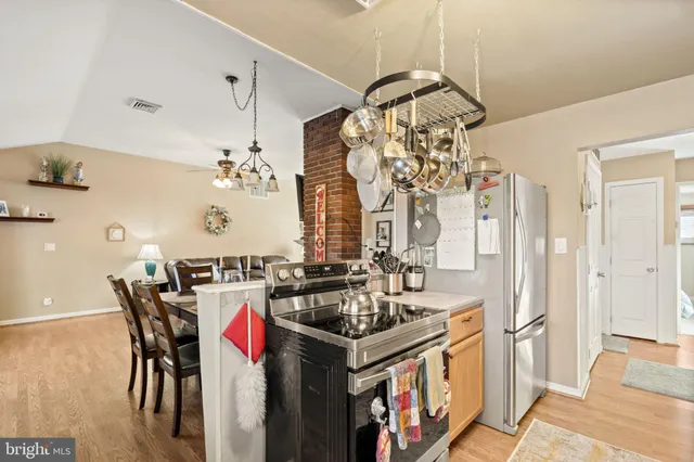 a kitchen with a stove and cabinets