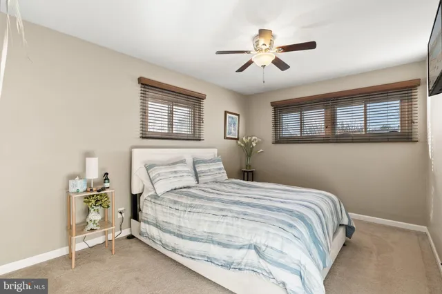 a view of a hallway to a livingroom and a hallway