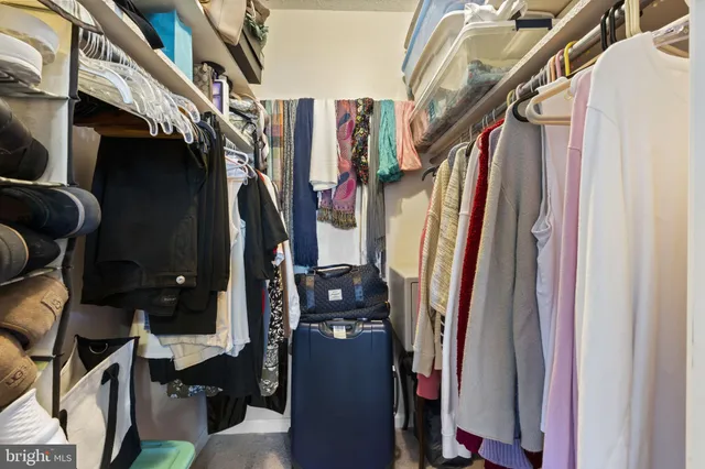 a bed room with furniture and a window