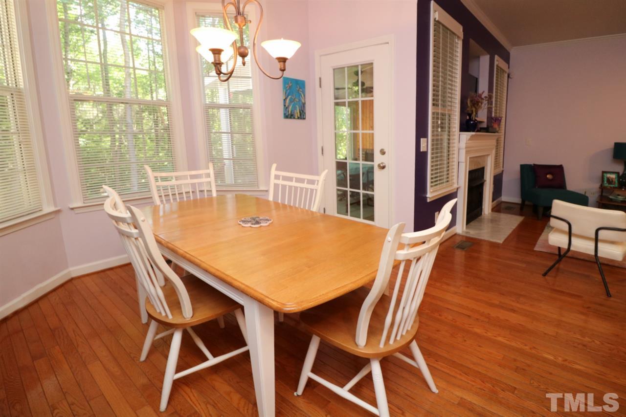 4703 Malone Court Raleigh, NC 27616 - Photo 13 of 30 a view of a dining room with furniture and wooden floor