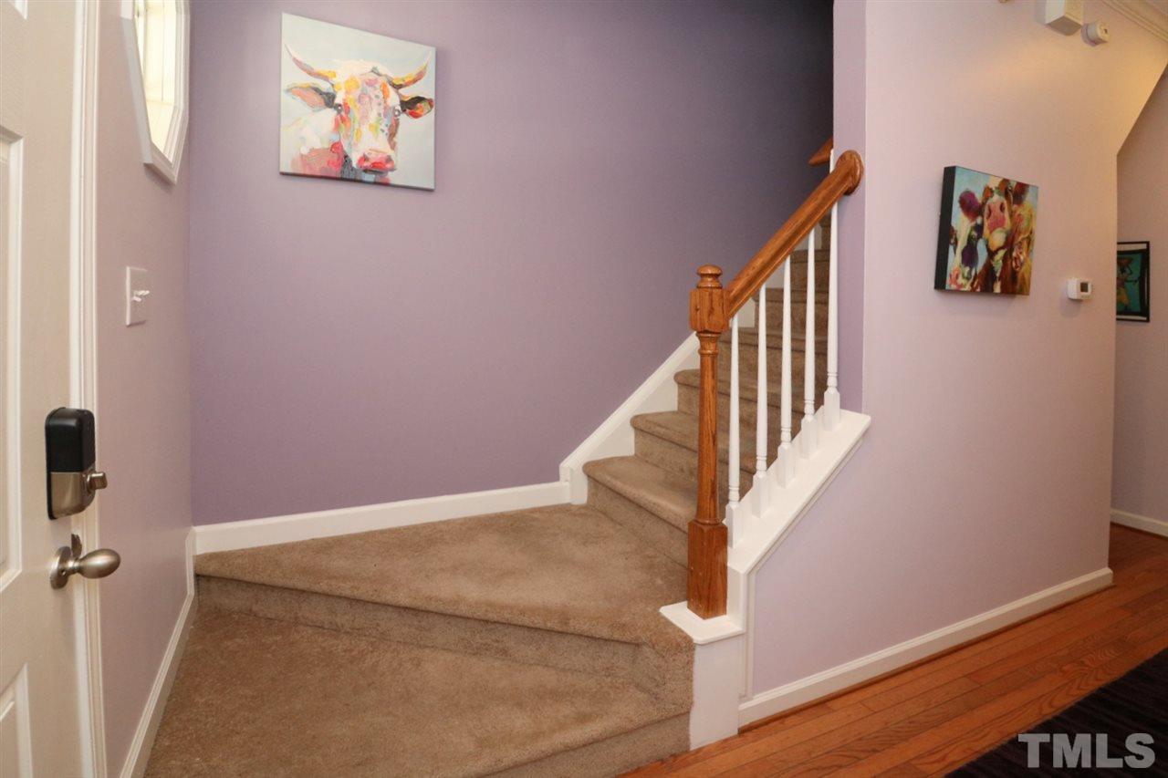 4703 Malone Court Raleigh, NC 27616 - Photo 16 of 30 a view of entryway and hall with wooden floor