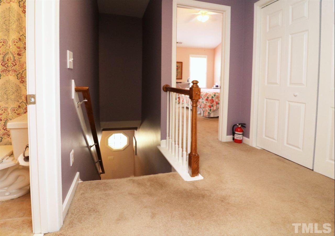 4703 Malone Court Raleigh, NC 27616 - Photo 17 of 30 a view of empty room with wooden floor