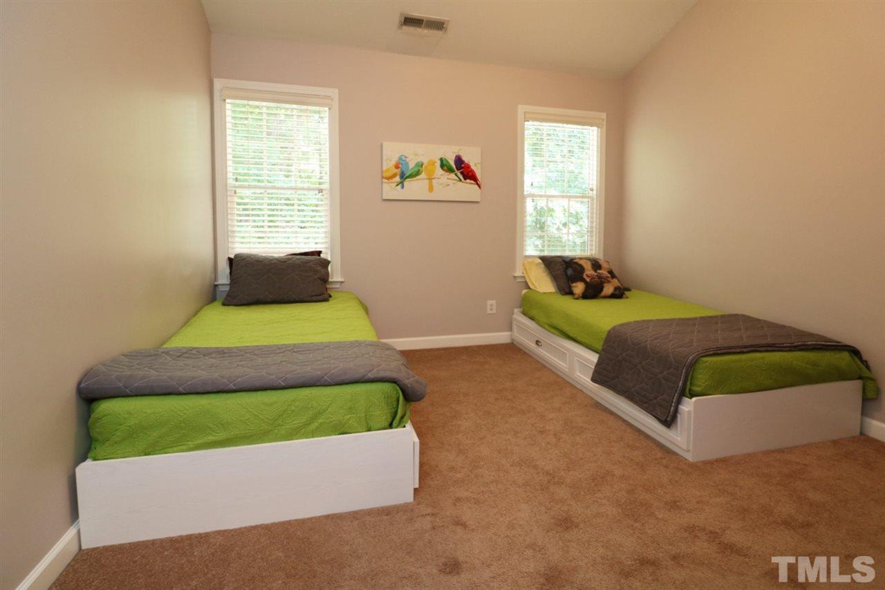 4703 Malone Court Raleigh, NC 27616 - Photo 19 of 30 a bedroom with a bed and a window