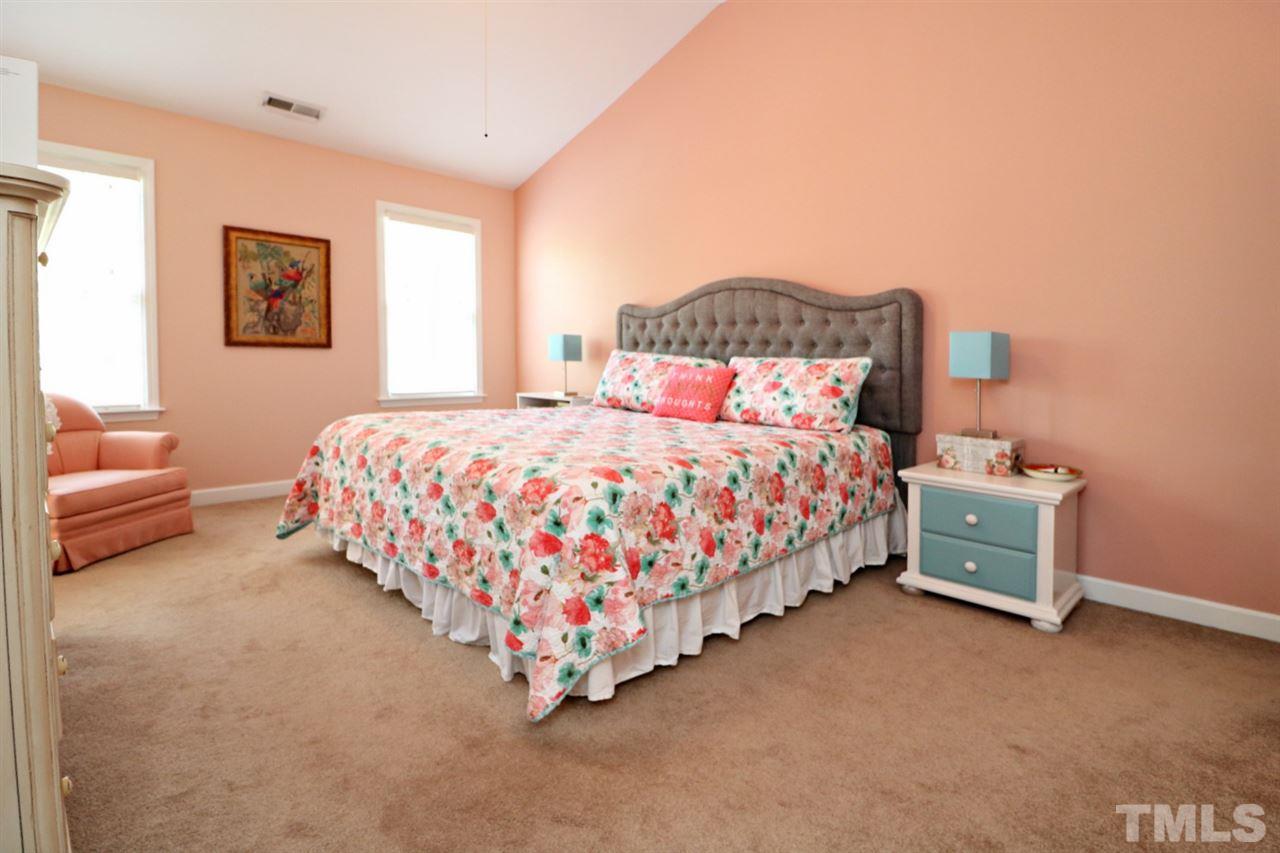 4703 Malone Court Raleigh, NC 27616 - Photo 23 of 30 a bedroom with a bed and a couch