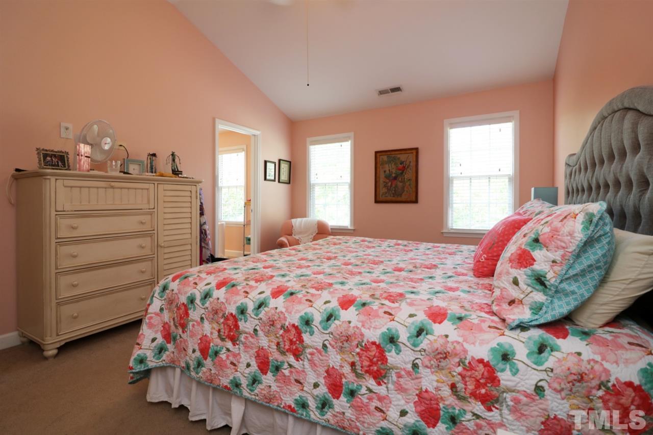 4703 Malone Court Raleigh, NC 27616 - Photo 25 of 30 a bedroom with a bed and a window
