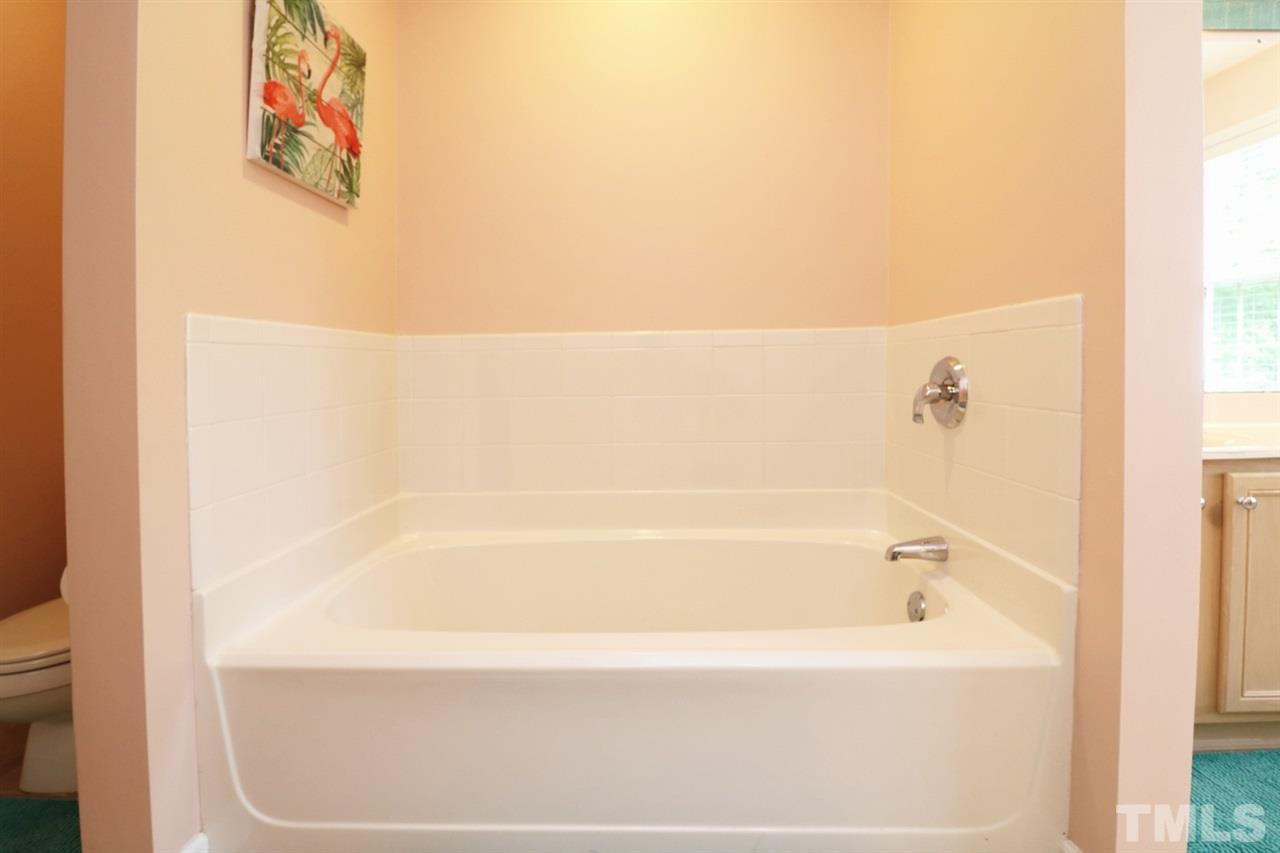 4703 Malone Court Raleigh, NC 27616 - Photo 30 of 30 a bathroom with a bathtub
