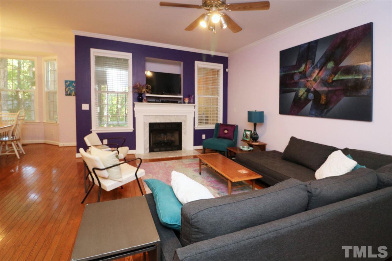 4703 Malone Court Raleigh, NC 27616 - Photo 5 of 30 a living room with furniture fireplace and flat screen tv