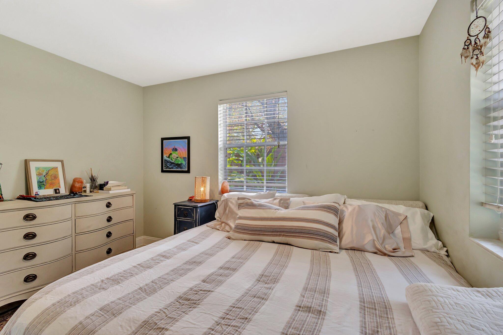 227 Northeast 12th Street, Unit 2 Delray Beach, FL 33444 - Photo 10 of 24 a bedroom with a bed and a window