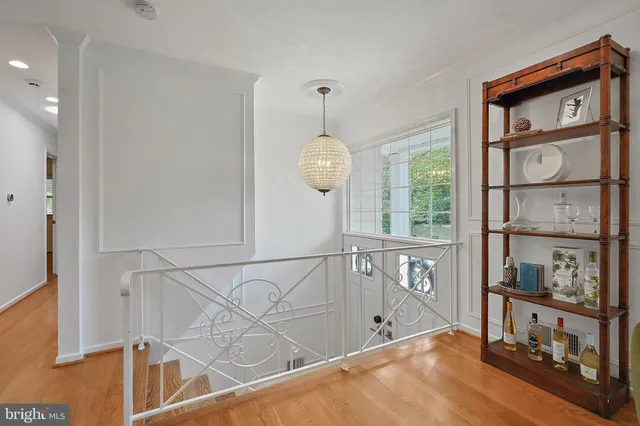 a view of an entryway with wooden floor
